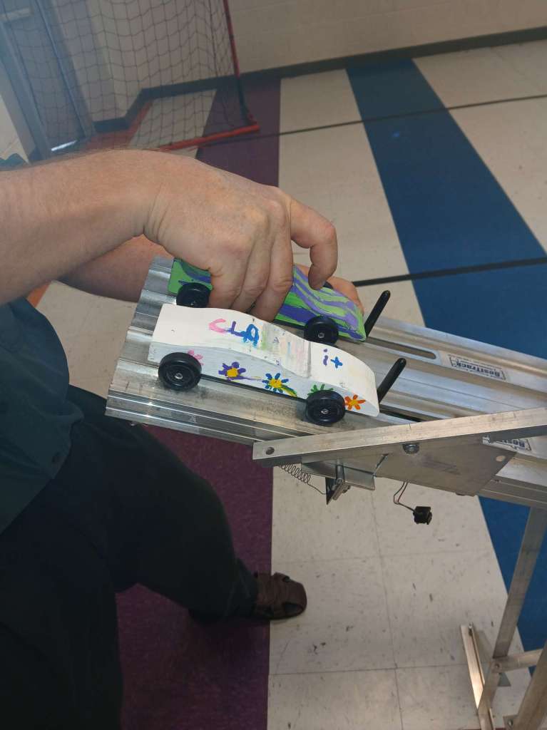 Pinewood derby cars ready to race